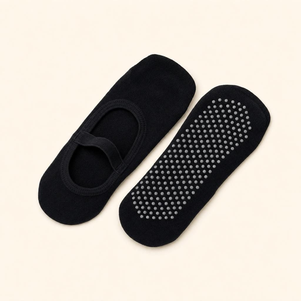 Paire de chaussettes de Pilates antidérapantes noires à picots de silicone